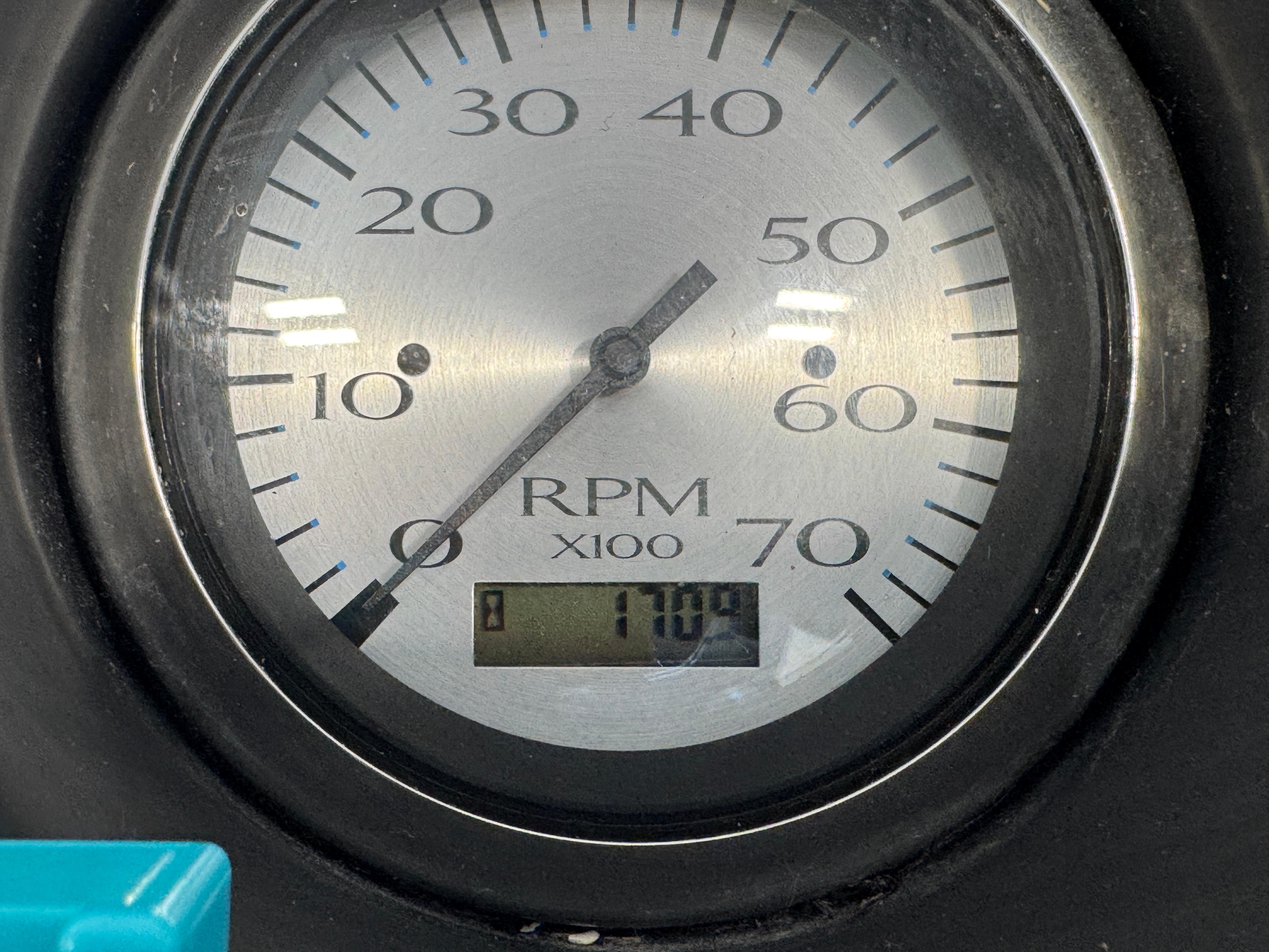 Slide: The Image of Close-up of a 2020 Bennington SX 22 SSRX RPM gauge displaying 1700 RPM. - 11