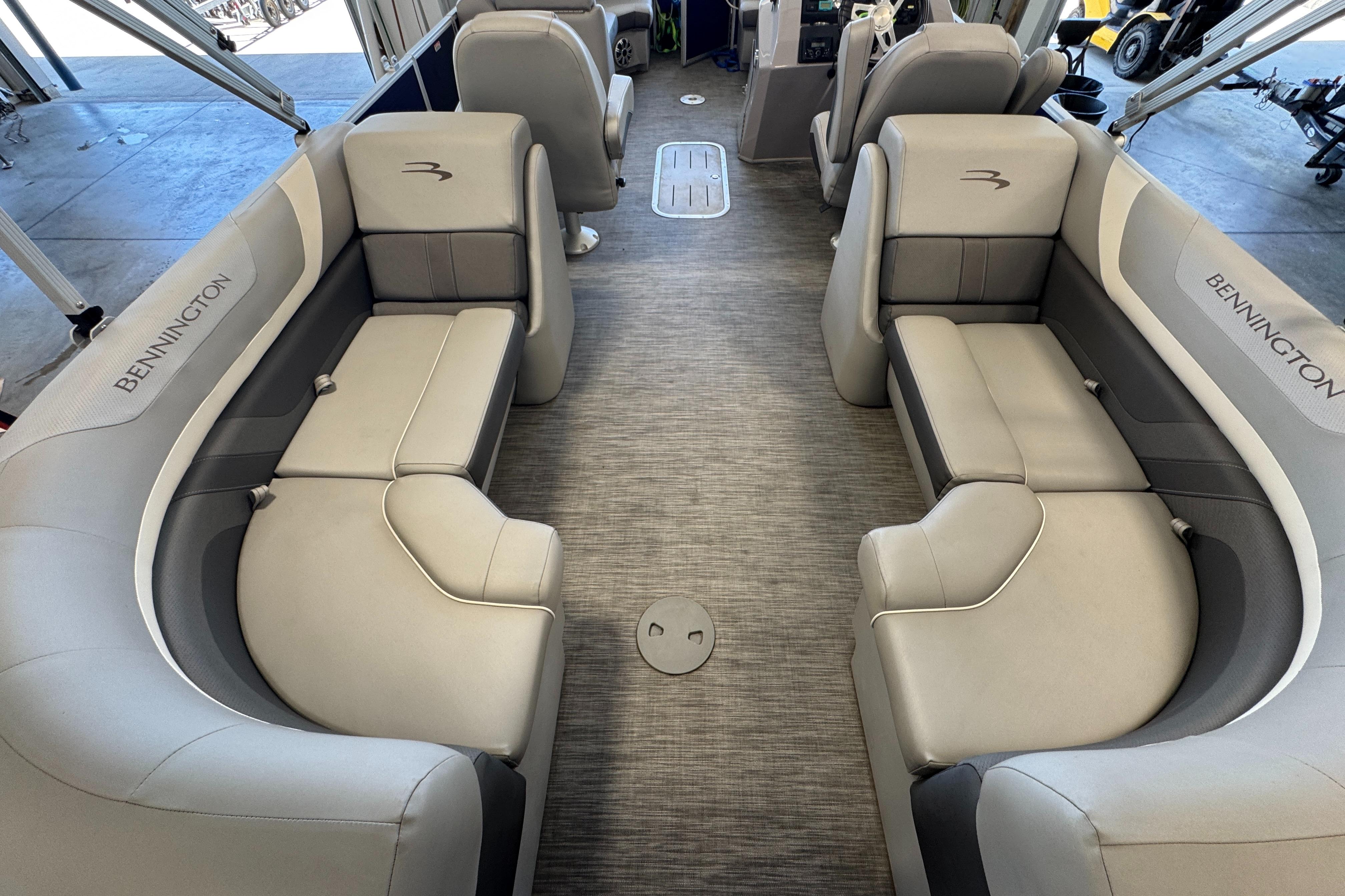 Slide: The Image of 2020 Bennington SX 22 SSRX boat interior with gray seating and spacious layout. - 12