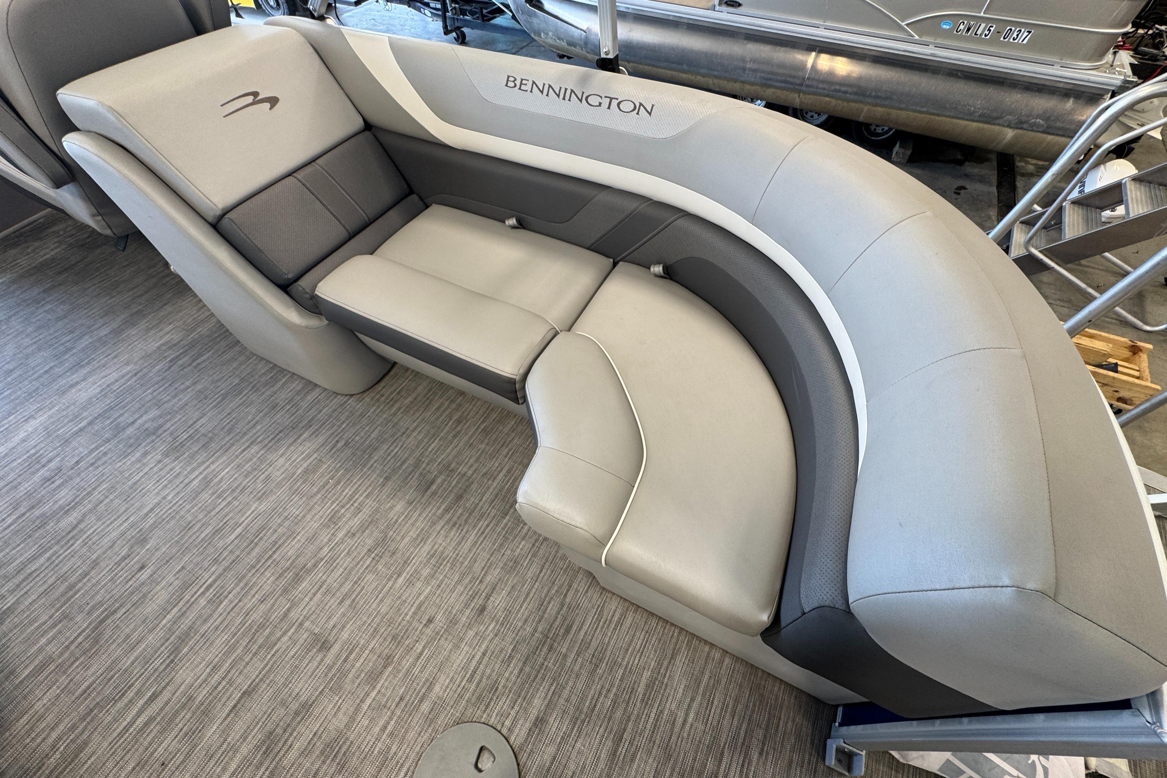 Slide: The Image of 2020 Bennington SX 22 SSRX boat interior with luxurious gray seating. - 13