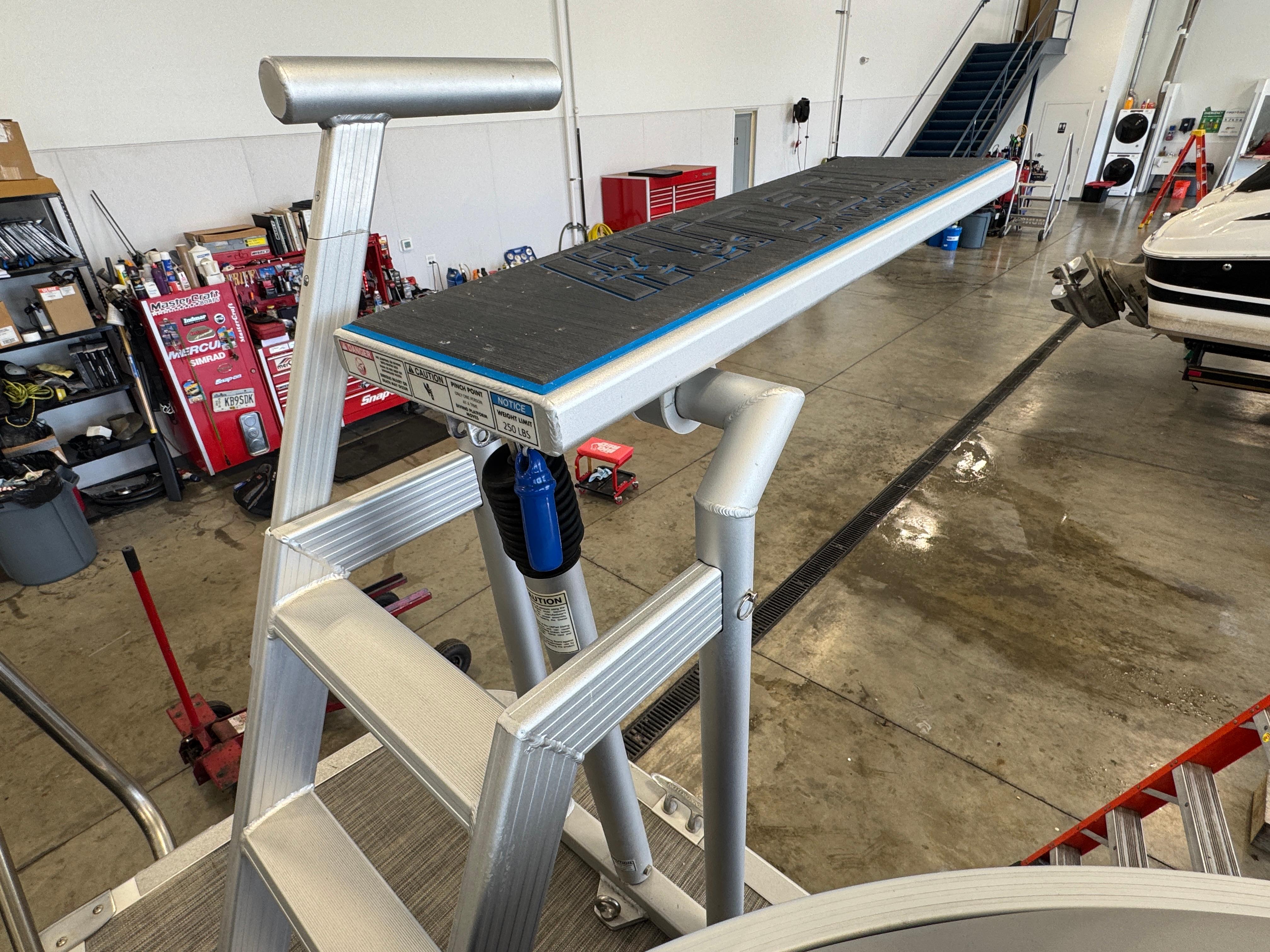 Slide: The Image of 2020 Bennington SX 22 SSRX boat ladder in a workshop setting. - 4