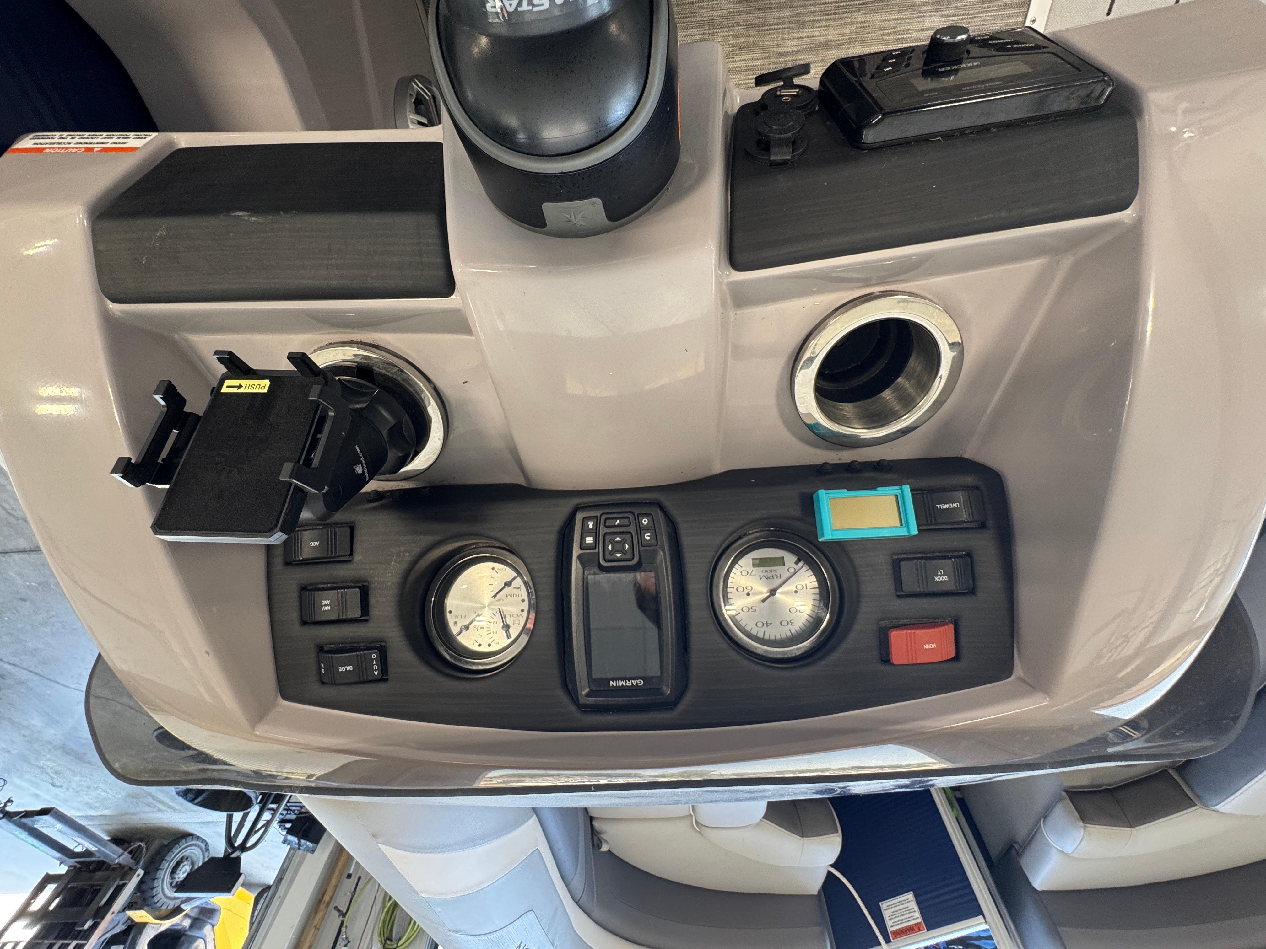 Slide: The Image of Control panel of a 2020 Bennington SX 22 SSRX boat with gauges and switches. - 7