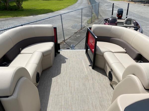 Slide: The Image of 2023 Bentley Pontoons 220 Navigator interior with beige seating and open gate. - 3
