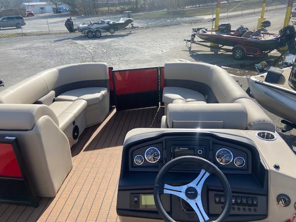Slide: The Image of 2023 Bentley Pontoons 220 Navigator interior with beige seating and modern dashboard. - 5