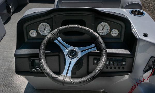 Slide: The Image of Steering console of 2024 Bentley Pontoons 240 Navigator with gauges and controls. - 10