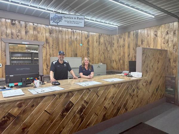 Slide: The Image of 2023 Bentley Pontoons Legacy 223 Navigator service and parts desk with staff. - 15