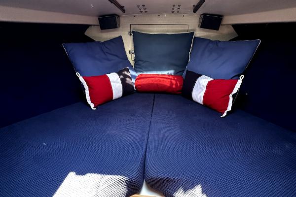 Slide: The Image of Cozy cabin interior of 1980 Bertram 33 Sport Fisherman with blue and red pillows. - 2