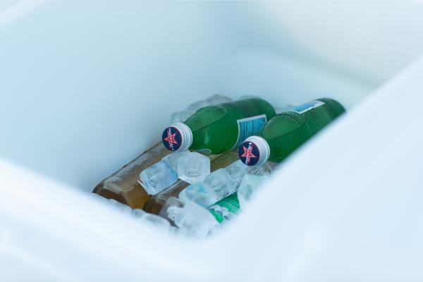 Slide: The Image of Bottles in ice-filled cooler on Bertram 35 Flybridge, 2023 model. - 11