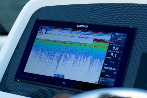 Slide: The Image of Simrad fishfinder display on 2023 Bertram 35 Flybridge boat. - 12