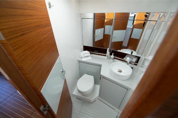 Slide: The Image of Modern bathroom in 2023 Bertram 35 Flybridge yacht with wood accents. - 18