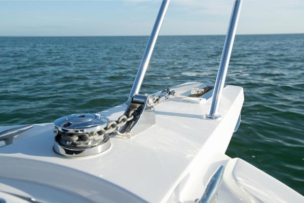 Slide: The Image of Close-up of the bow of a 2023 Bertram 35 Flybridge boat on the water. - 23