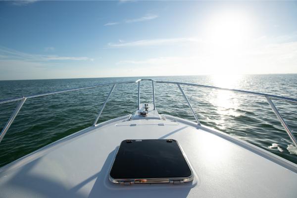 Slide: The Image of Bow view of 2023 Bertram 35 Flybridge yacht on open water. - 24