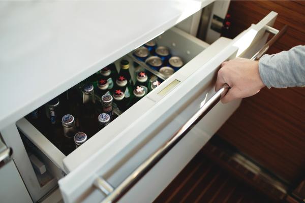 Slide: The Image of Drawer refrigerator stocked with beverages on a 2023 Bertram 35 Flybridge yacht. - 35