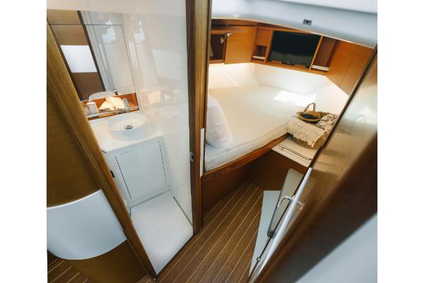 Slide: The Image of Interior cabin of 2023 Bertram 35 Flybridge yacht with bed and bathroom. - 6