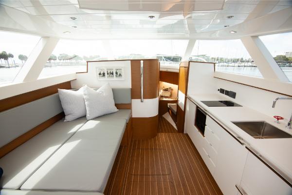 Slide: The Image of Interior of 2023 Bertram 35 Flybridge yacht with modern kitchen and seating area. - 8