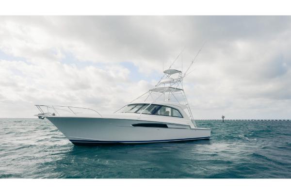 Slide: The Image of 2023 Bertram 50 Sport yacht on open water. - 12