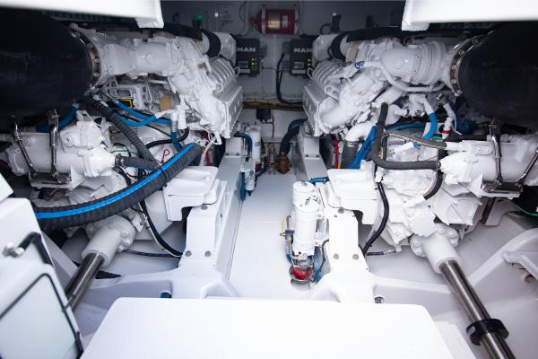 Slide: The Image of Engine room of a 2023 Bertram 50 Sport yacht with dual MAN engines. - 32