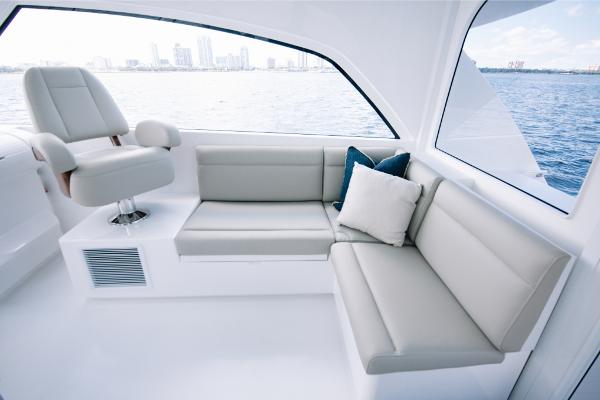 Slide: The Image of Interior of 2023 Bertram 50 Sport yacht with modern seating and ocean view. - 42