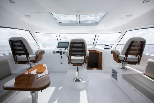 Slide: The Image of Interior of 2023 Bertram 50 Sport yacht with modern helm and seating. - 43