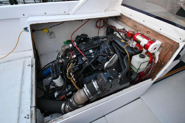 Slide: The Image of 1965 Bertram Sportfisher engine compartment with visible wiring and components. - 35