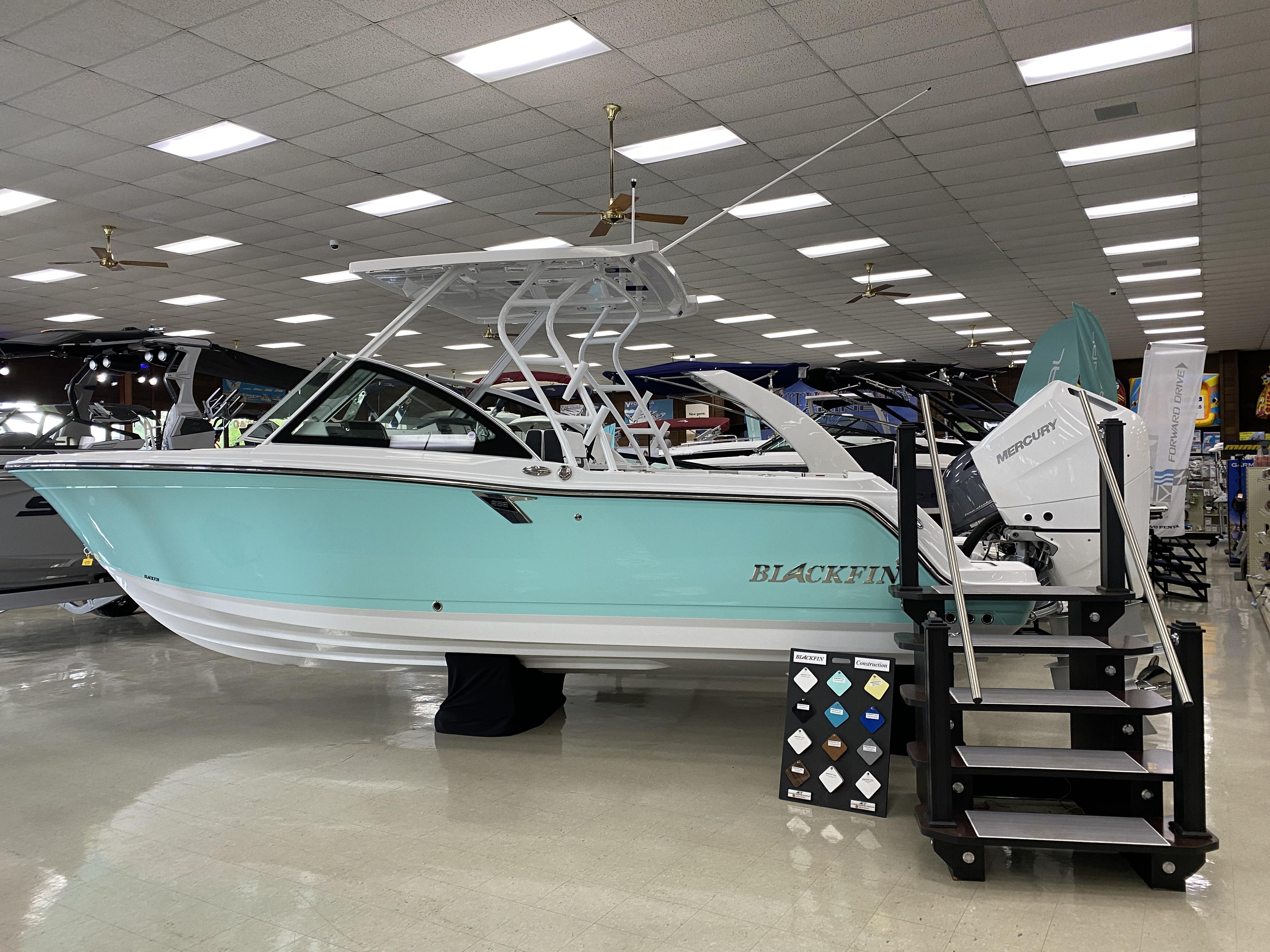 Slide: The Image of 2023 Blackfin 252 DC boat on display in showroom. - 1