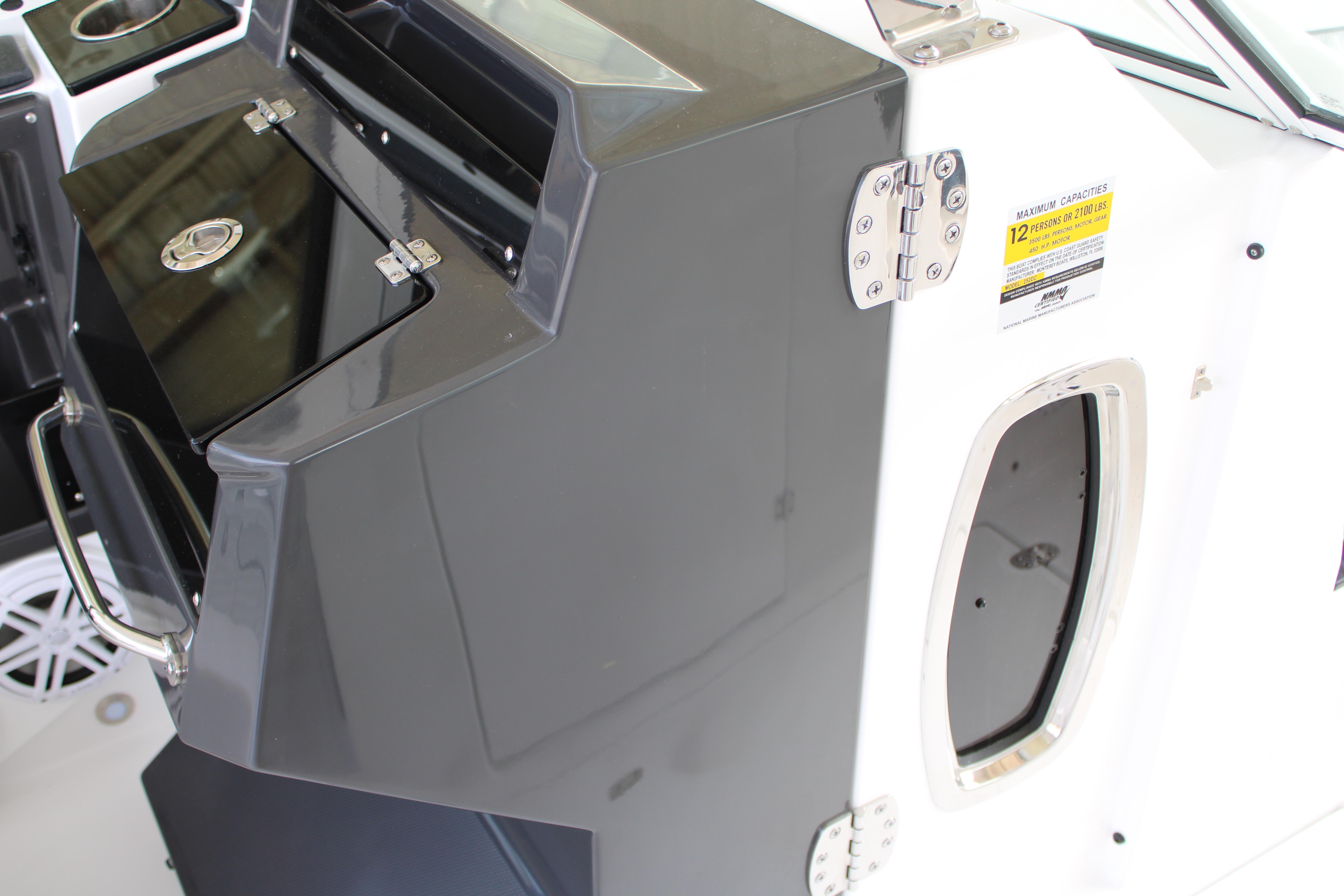 Slide: The Image of 2023 Blackfin 252 DC boat interior, featuring storage compartments and capacity label. - 21