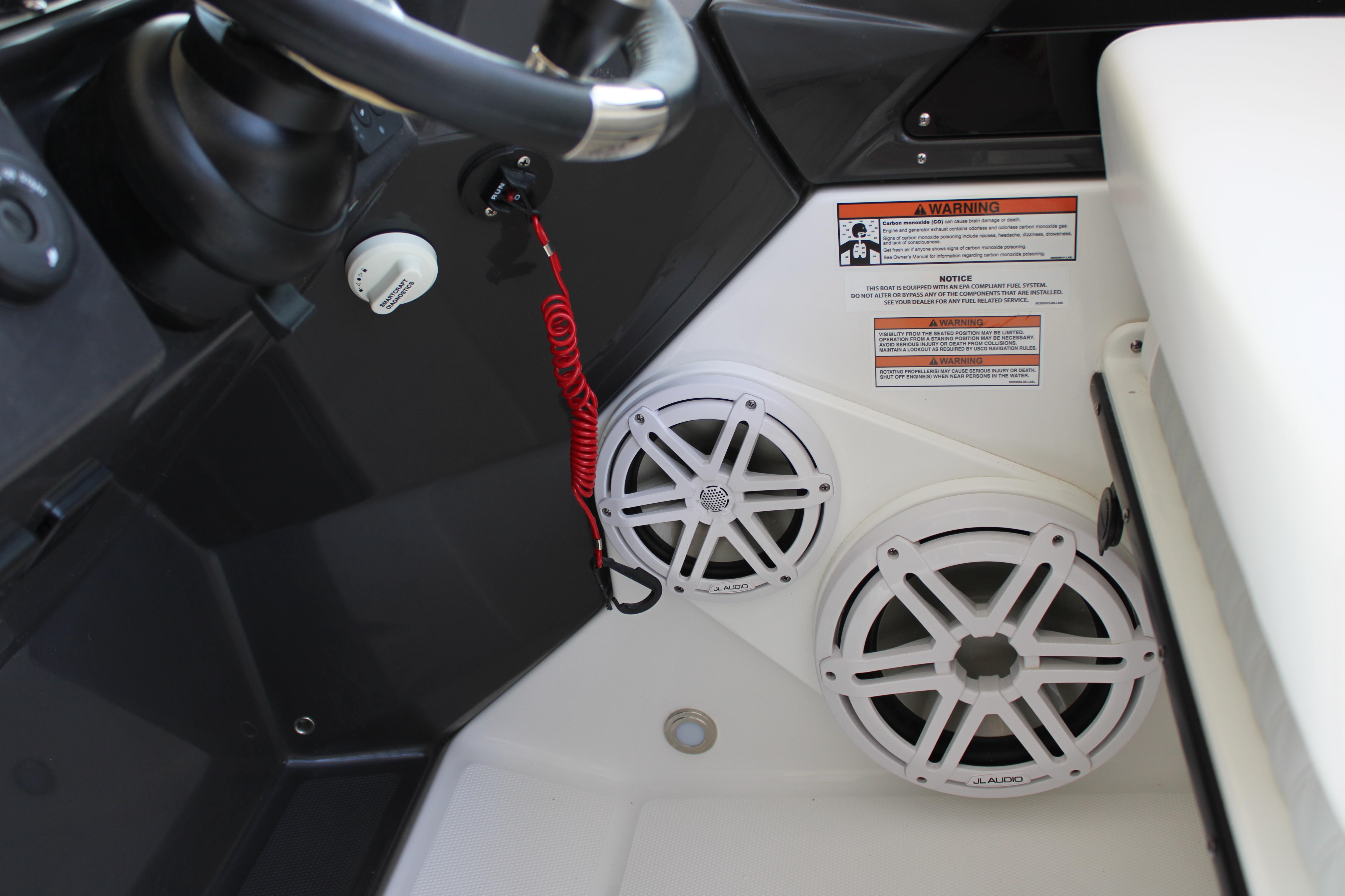 Slide: The Image of Close-up of the 2023 Blackfin 252 DC boat dashboard with JL Audio speakers. - 27