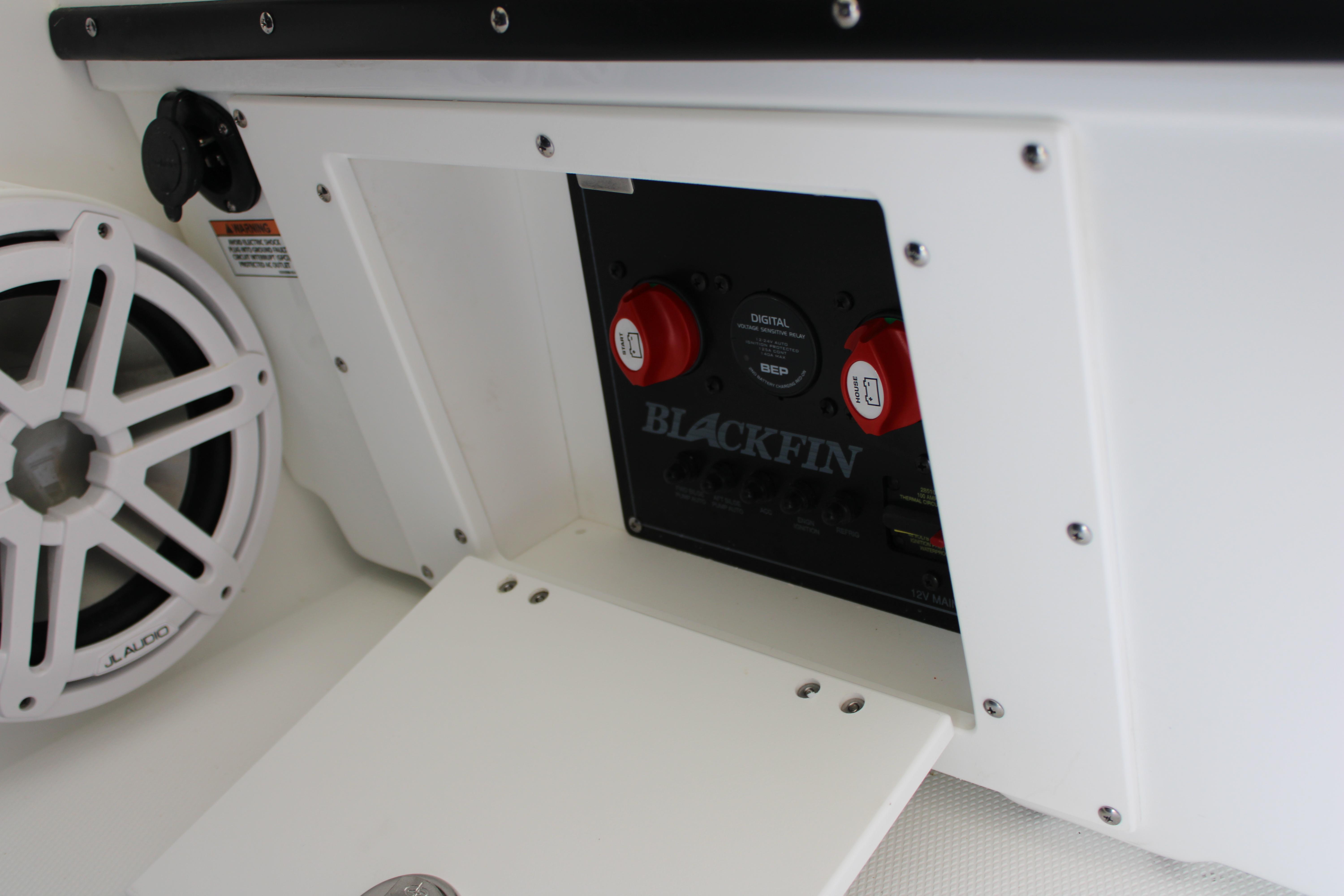 Slide: The Image of Control panel of 2023 Blackfin 252 DC boat with JL Audio speaker. - 29
