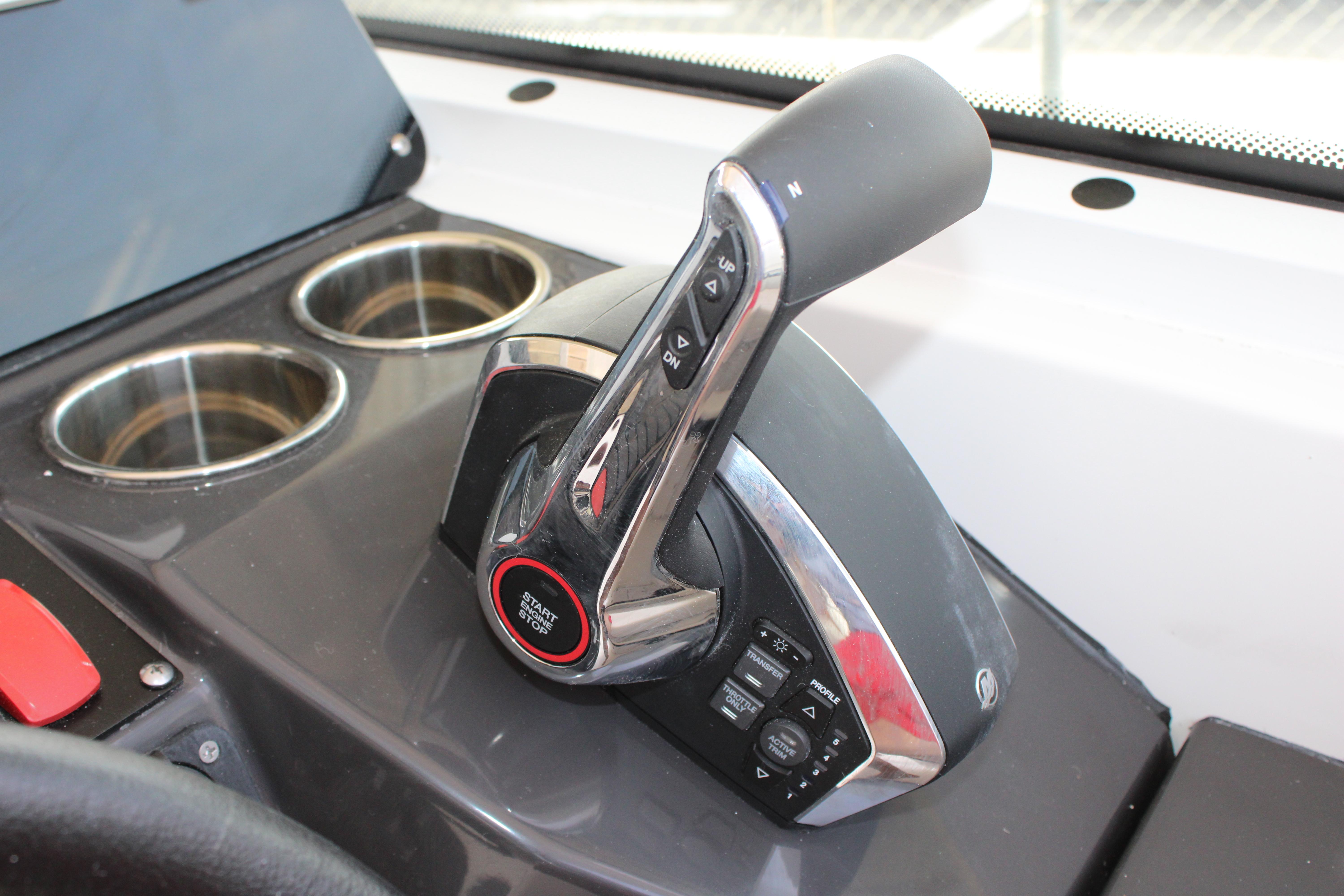 Slide: The Image of Close-up of the control lever on a 2023 Blackfin 252 DC boat. - 32