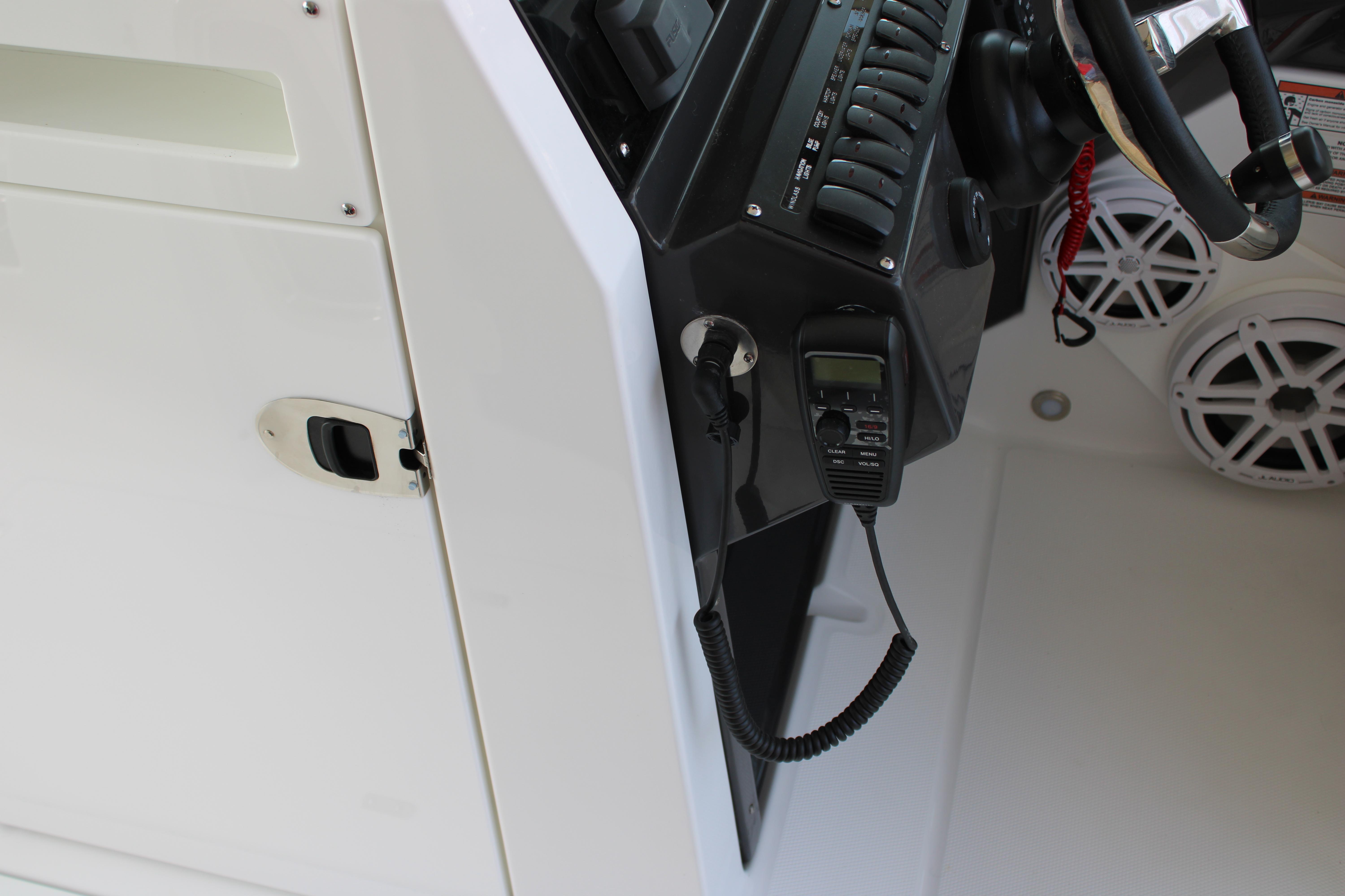 Slide: The Image of 2023 Blackfin 252 DC boat dashboard with radio and control panel. - 33