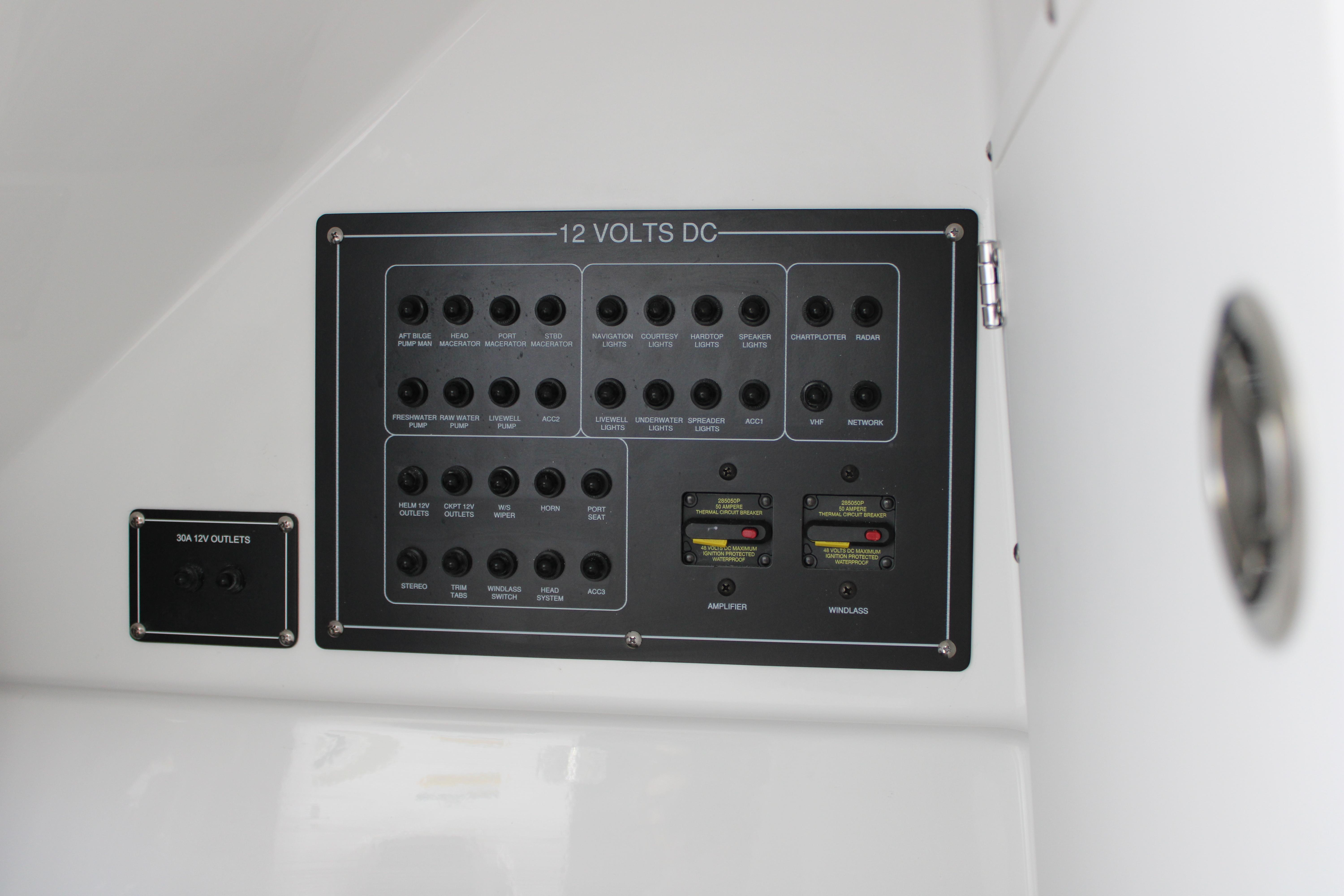 Slide: The Image of 2023 Blackfin 252 DC 12V control panel with various switches and outlets. - 36