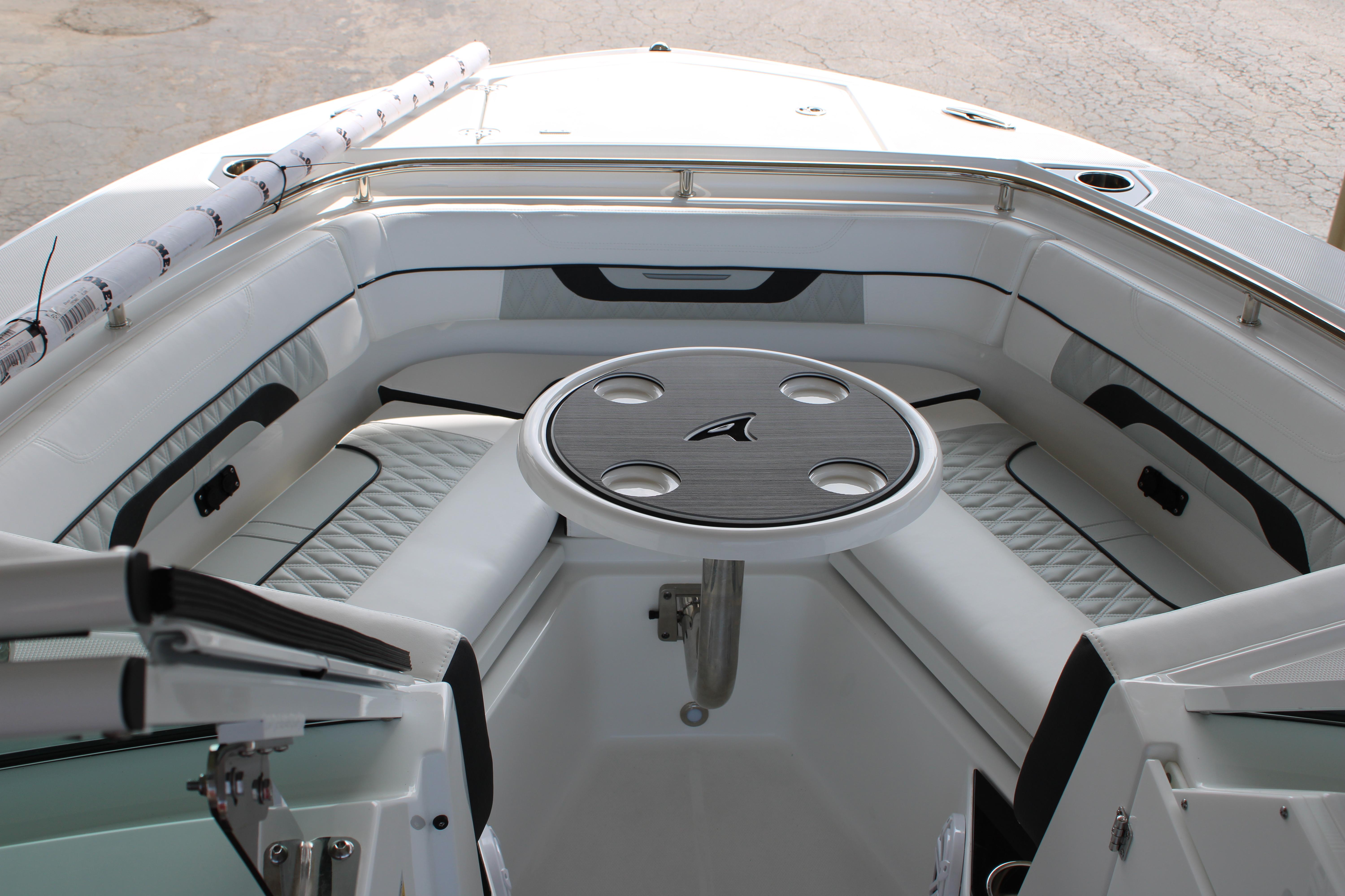 Slide: The Image of 2023 Blackfin 252 DC boat interior with cushioned seating and round table. - 38
