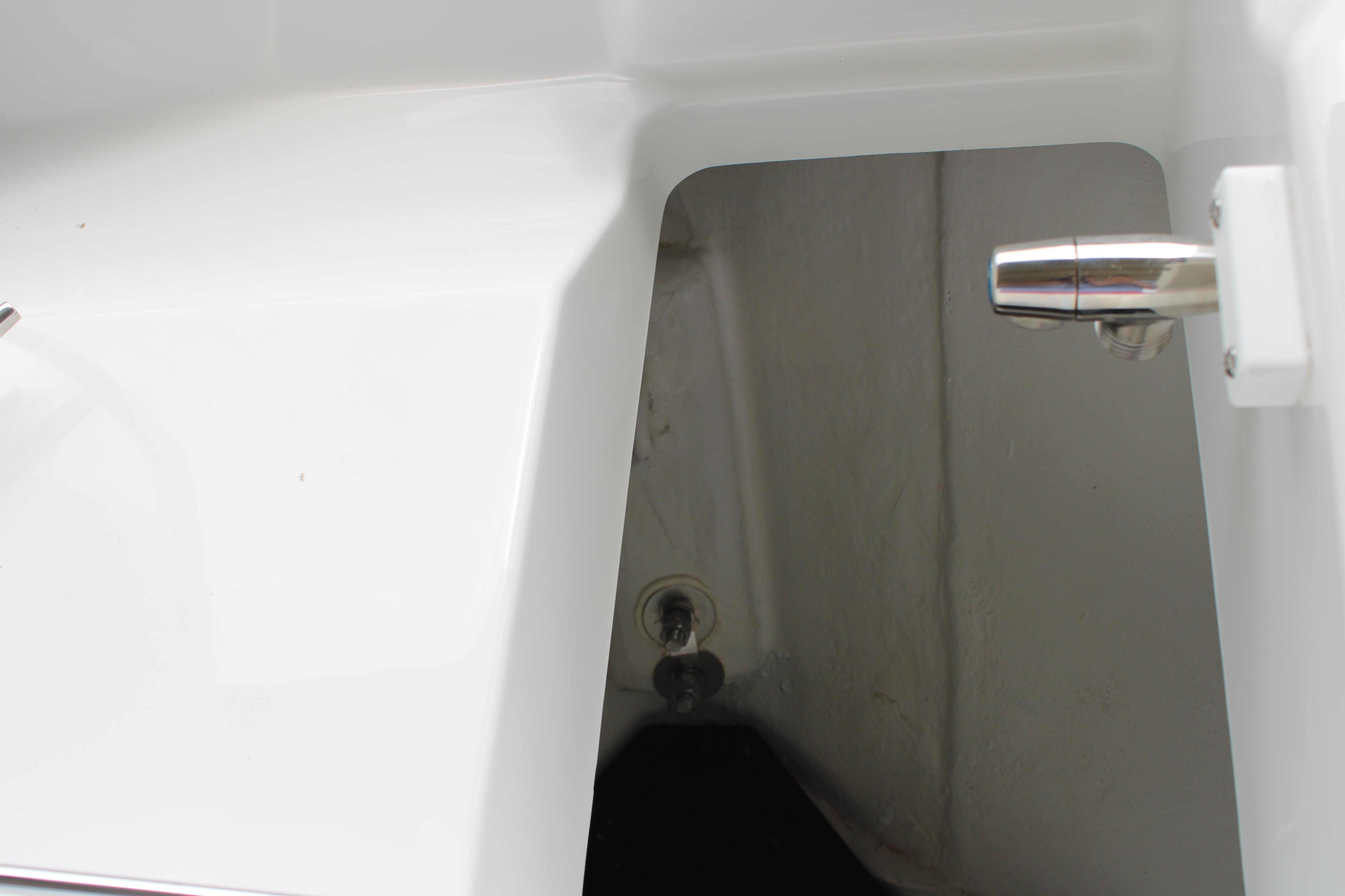 Slide: The Image of Close-up of the 2023 Blackfin 252 DC boat's storage compartment and latch. - 43