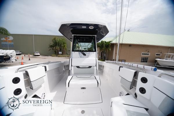 Slide: The Image of 2024 Blackfin 272 CC boat interior, showcasing sleek design and spacious seating. - 14
