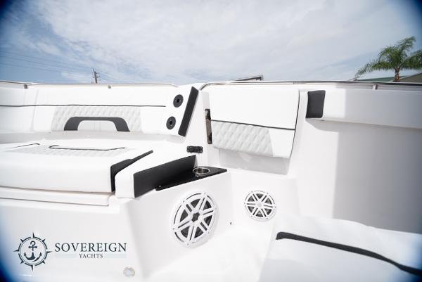 Slide: The Image of 2024 Blackfin 272 CC boat interior with sleek white seating and modern design. - 17