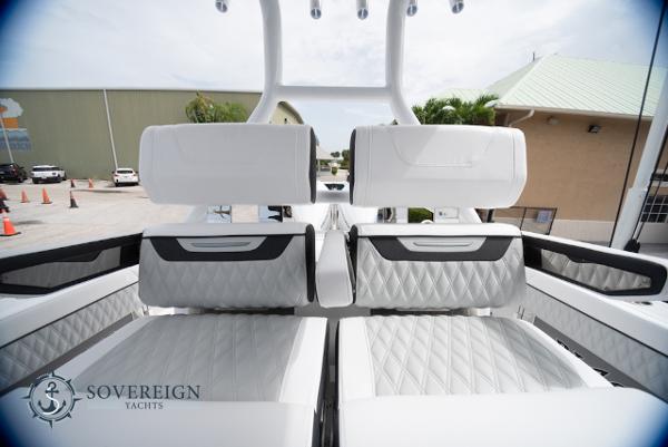 Slide: The Image of 2024 Blackfin 272 CC luxury yacht interior with diamond-stitched seating, showcased by Sovereign Yachts. - 27