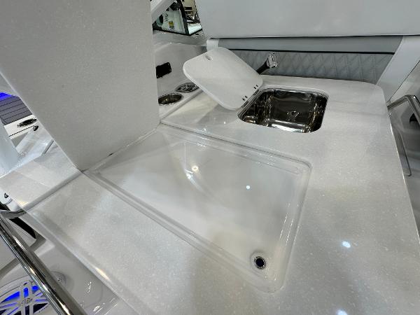 Slide: The Image of 2024 Blackfin 302 DC boat interior with sleek countertop and sink. - 13