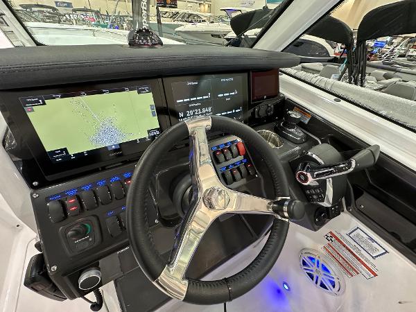 Slide: The Image of 2024 Blackfin 302 DC boat dashboard with advanced navigation and control systems. - 15