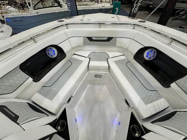 Slide: The Image of 2024 Blackfin 302 DC boat interior with luxurious seating and modern speakers. - 25
