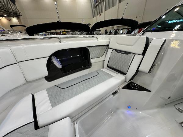 Slide: The Image of 2024 Blackfin 302 DC boat interior with luxurious white seating and modern design. - 26