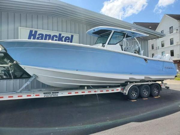 Slide: The Image of 2023 Blackfin 332cc boat on a trailer at Hanckel Marine dealership. - 1