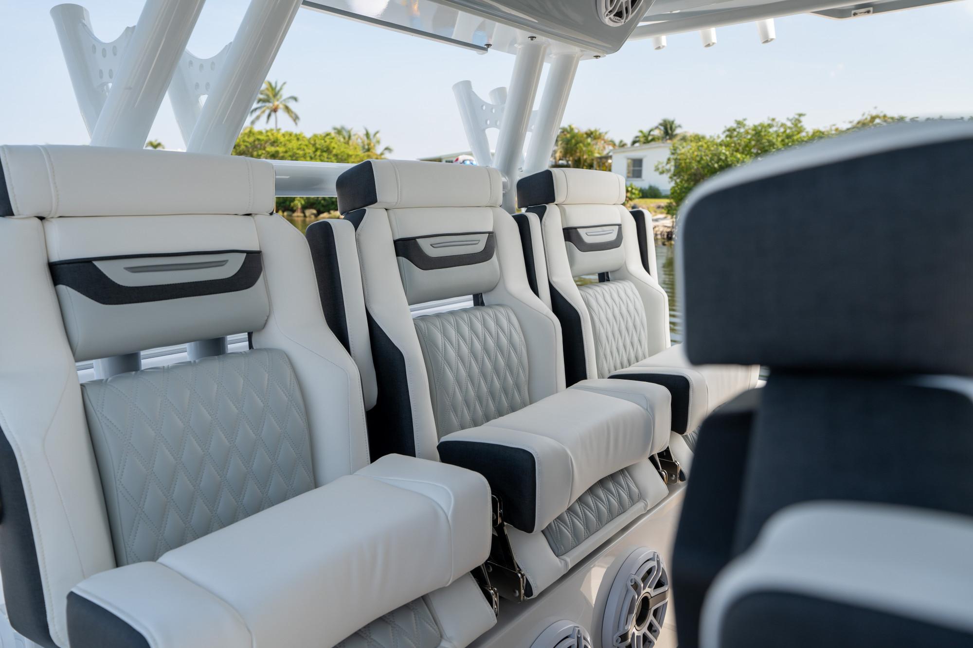 Slide: The Image of 2024 Blackfin 400 CC boat interior with luxurious seating and modern design. - 21