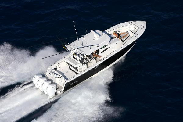 Slide: The Image of 2025 Blackfin 400 CC boat cruising on open water, aerial view. - 0