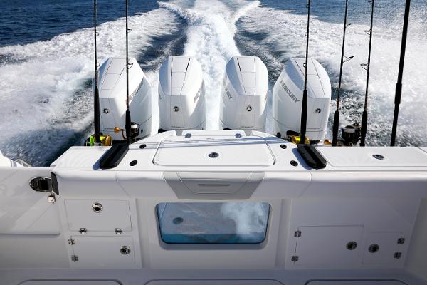 Slide: The Image of 2025 Blackfin 400 CC boat with four powerful engines cruising on open water. - 10