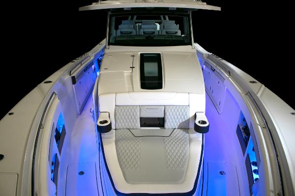 Slide: The Image of 2025 Blackfin 400 CC boat with illuminated deck and modern seating. - 21
