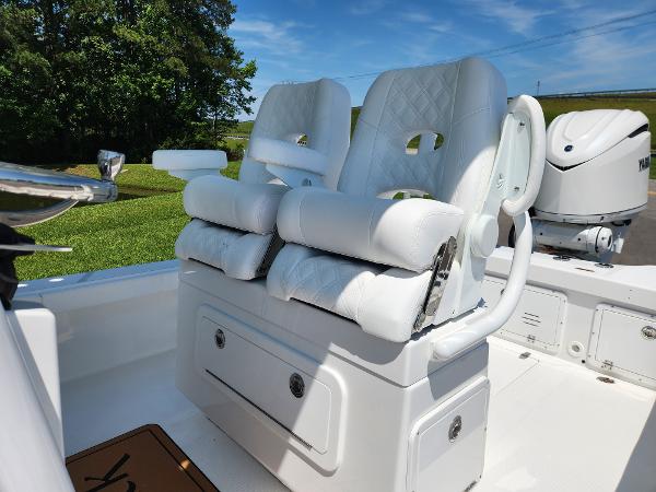 Slide: The Image of 2025 BlackJack 256 Coastal boat with white cushioned seats and modern design. - 11