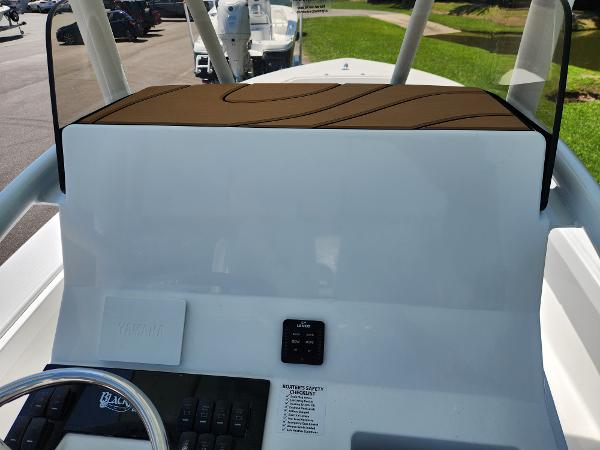 Slide: The Image of 2025 BlackJack 256 Coastal boat console with modern controls and sleek design. - 17