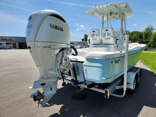 Slide: The Image of 2025 BlackJack 256 Coastal boat with Yamaha engine on trailer, parked outdoors. - 4