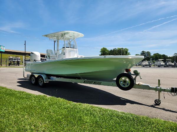 Slide: The Image of 2025 BlackJack 256 Coastal boat on trailer under clear blue sky. - 7