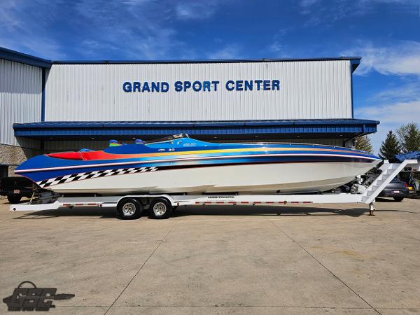Slide: The Image of 2002 Black Thunder 460 SC boat on trailer at Grand Sport Center. - 1