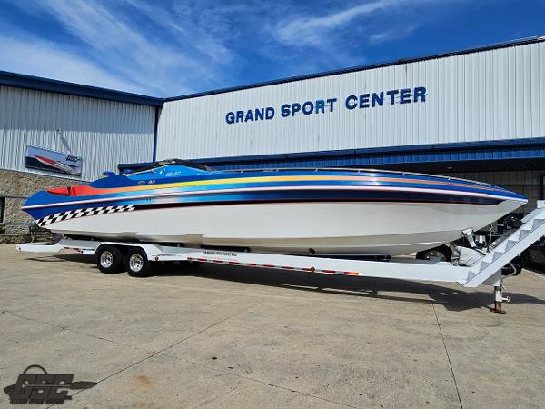 Slide: The Image of 2002 Black Thunder 460 SC boat on trailer at Grand Sport Center. - 11